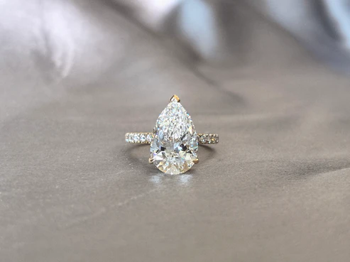 ddaf4e2bfe6446ac40cbc710c0d30436 Pear-Shaped Minimalist Pavé Ring | Half Eternity Design | Elegant Teardrop Silhouette | Lab-Grown Diamonds - Image 1
