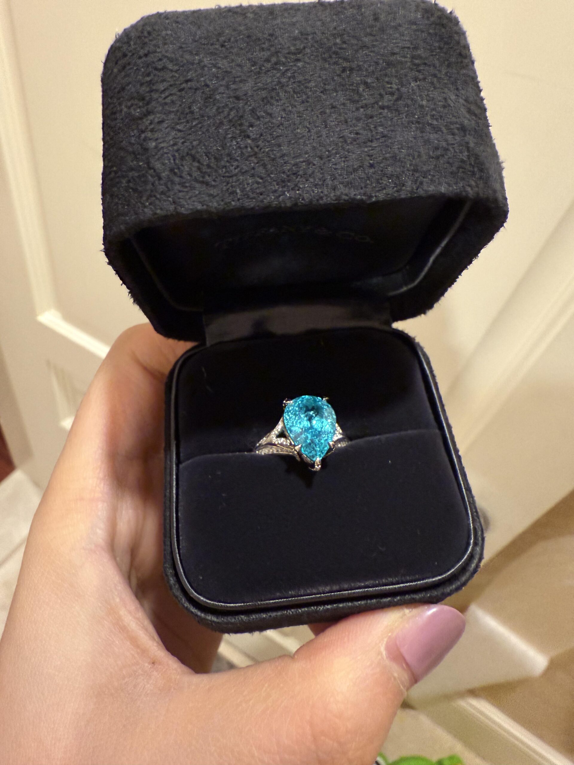 317d6a1329140243b0ec69d869b48d56 8.37-Carat Pear-Shaped Natural Paraiba Tourmaline Ring: 18K White Gold Setting with Lab-Grown Diamond Accents - Image 1