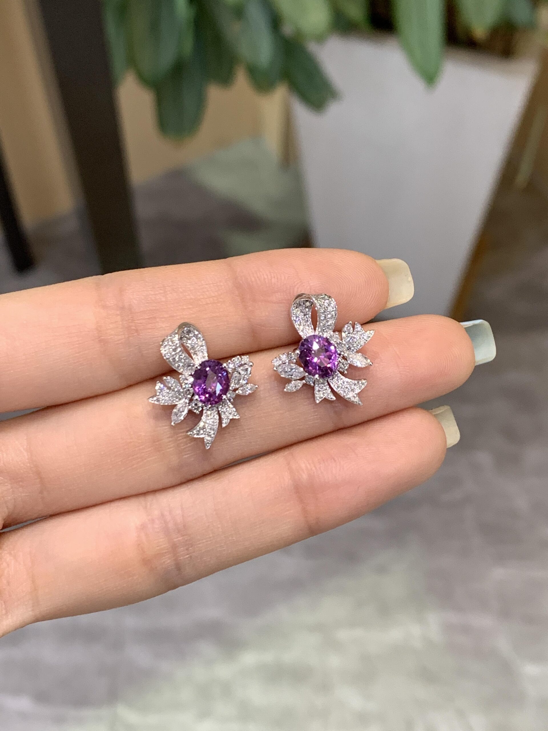 81da59e572c2f249da219287ff84ad78 1-Carat Lab-Grown Violet Sapphire Bow-Floral Stud Earrings - Image 1